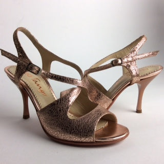 Elegant high-heeled sandals with metallic bronze finish and ankle straps.