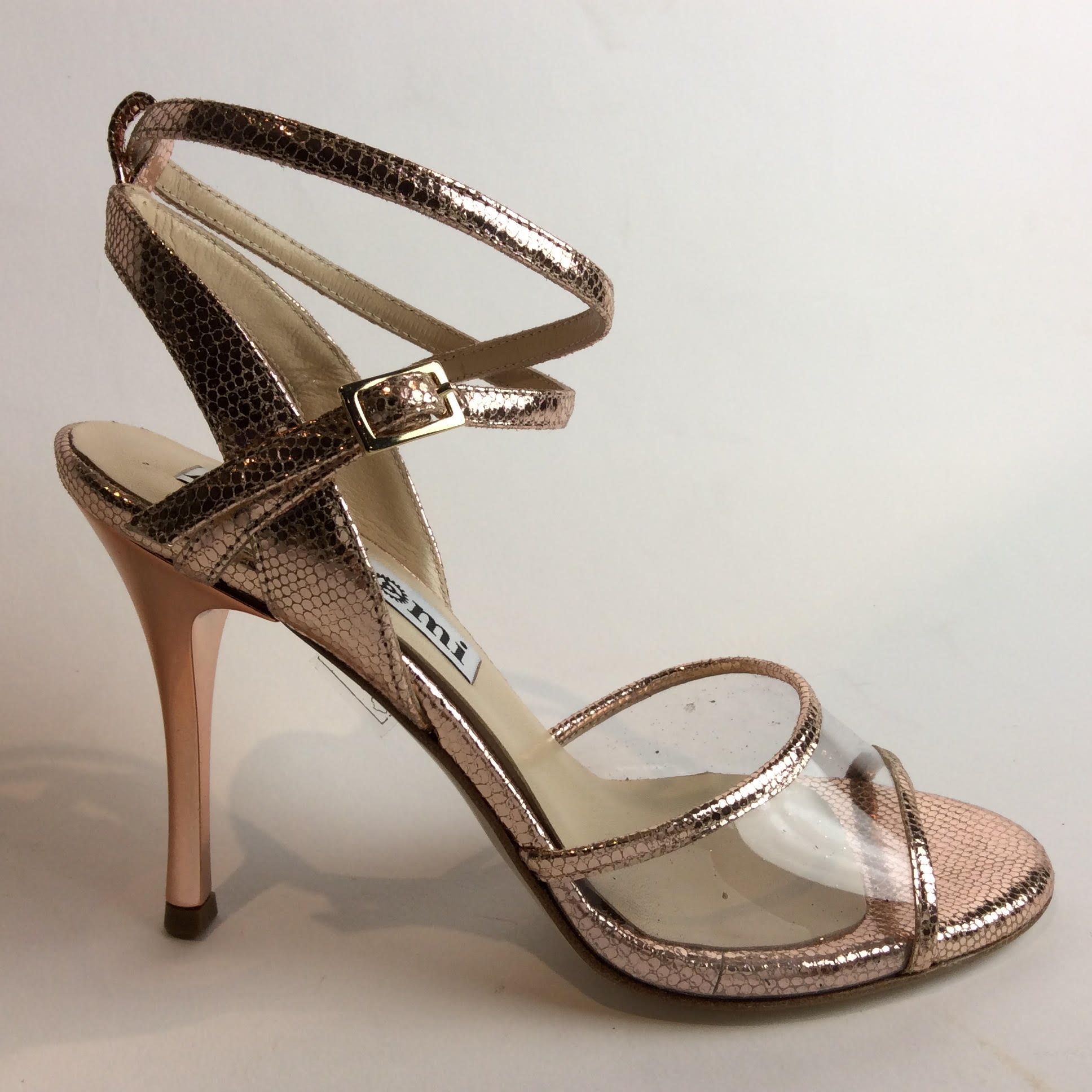 Elegant peep-toe high heel sandal with ankle strap.