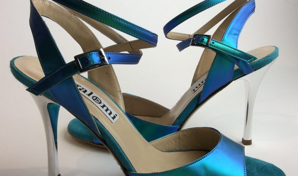 Elegant blue high-heeled sandals with ankle straps.
