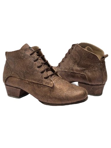 Pair of worn brown leather ankle boots with laces.
