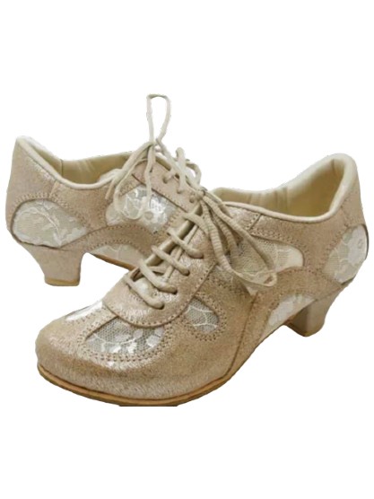 Pair of beige lace-up shoes with a slight heel.