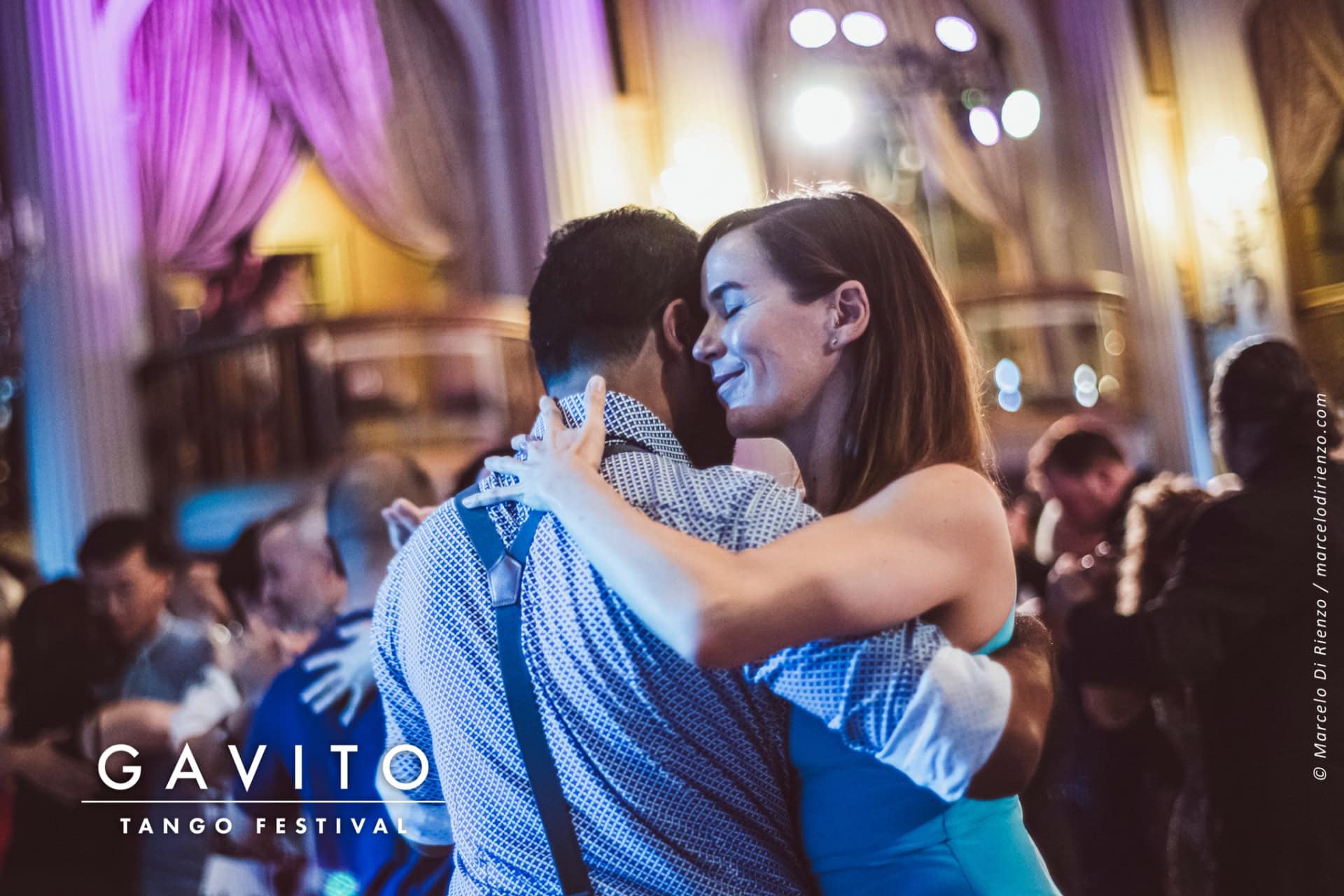 Couple sharing a romantic dance moment at a wedding.