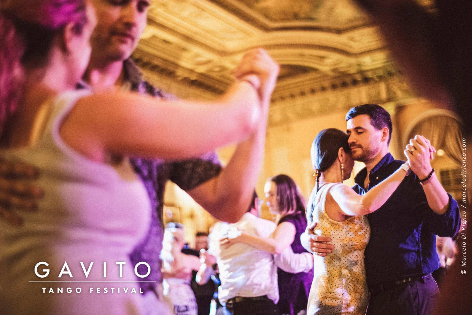 People dancing joyfully at a lively indoor celebration.