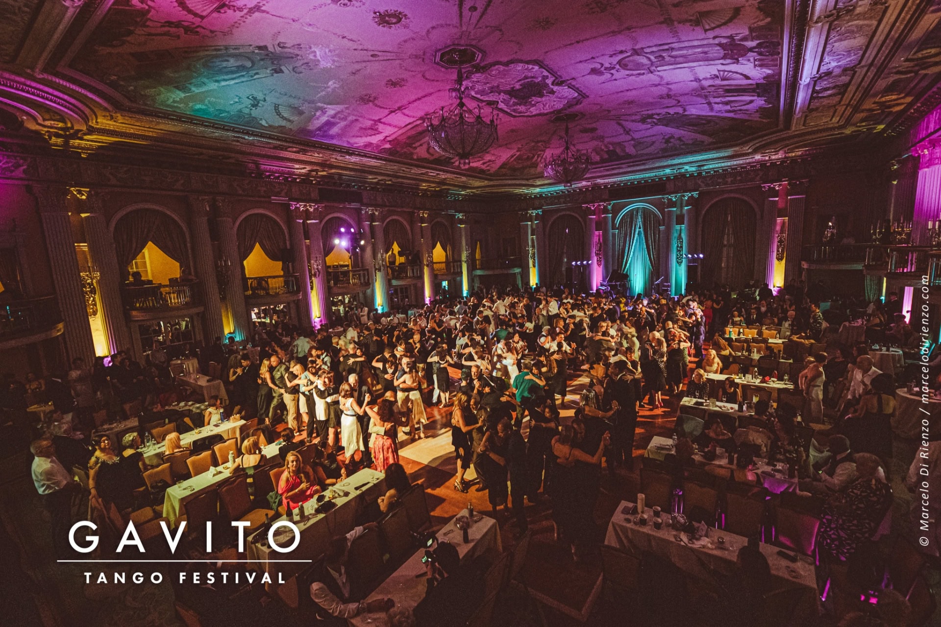 Elegant banquet hall set for a formal dinner with ambient lighting.